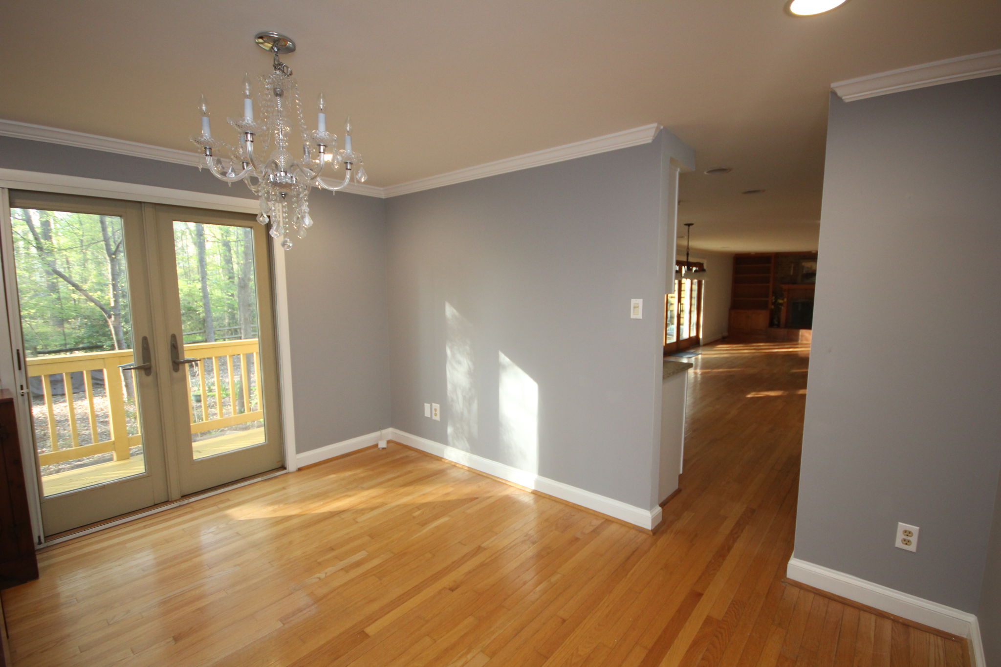 Separate dining room with porch doors to backyard