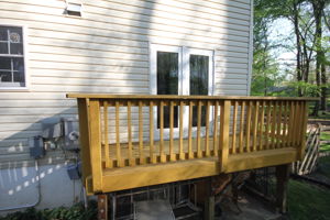 Deck overlooks entire backyard