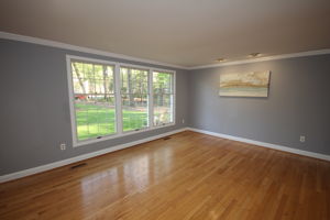Large living room with recessed lights throughout