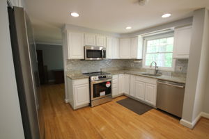 Granite countertops, backsplash, built-in soap dispenser