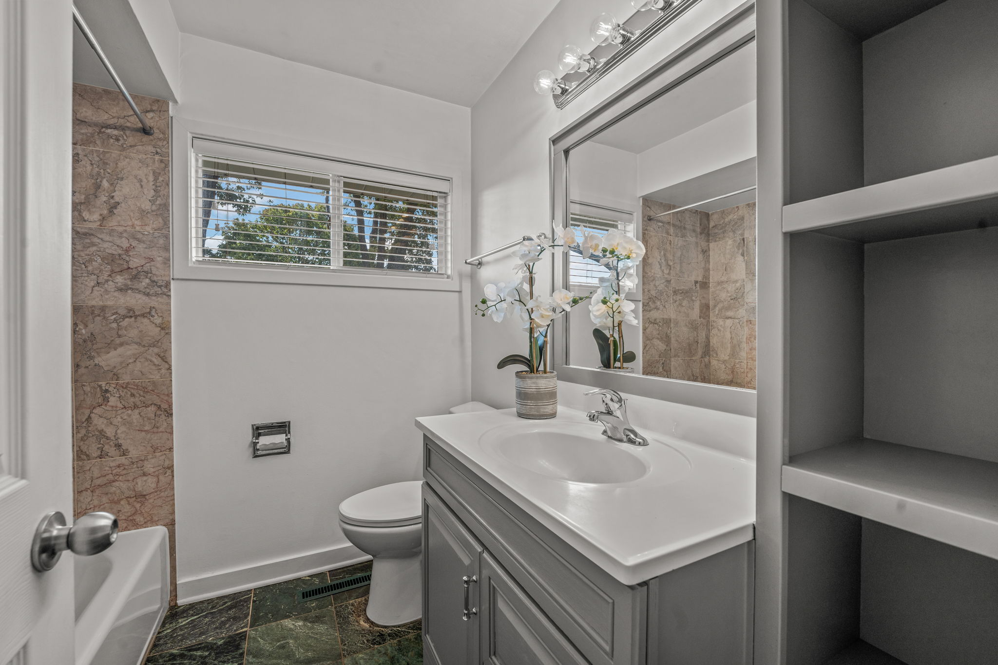 Main Floor Full Bath with Marble Tub Surround