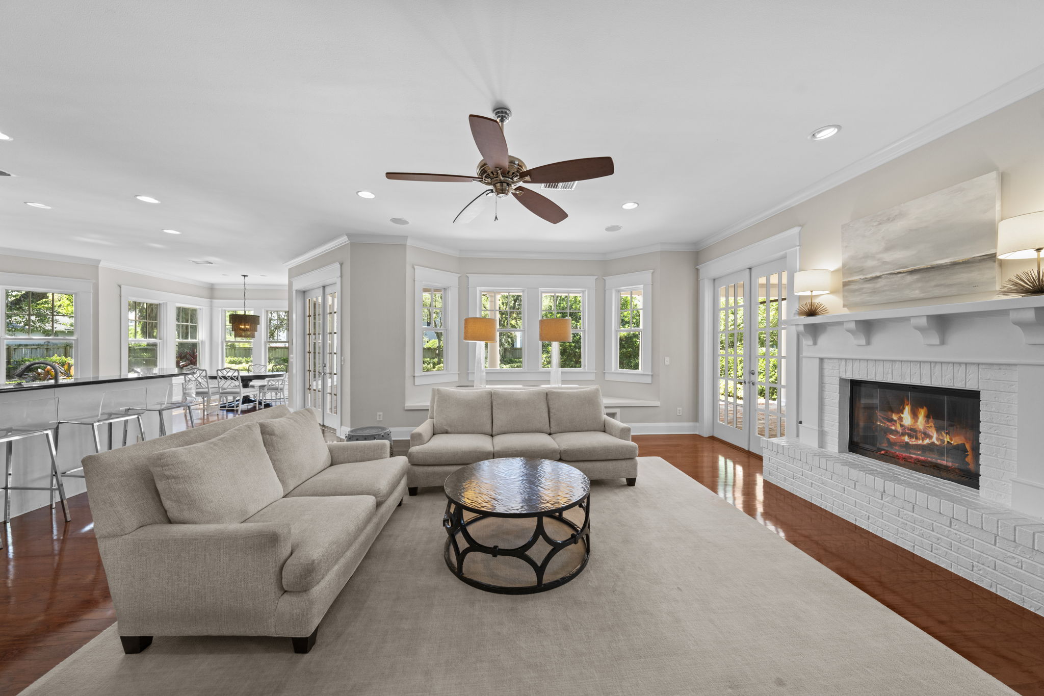 Adjacent living room with gas and wood burning fireplace