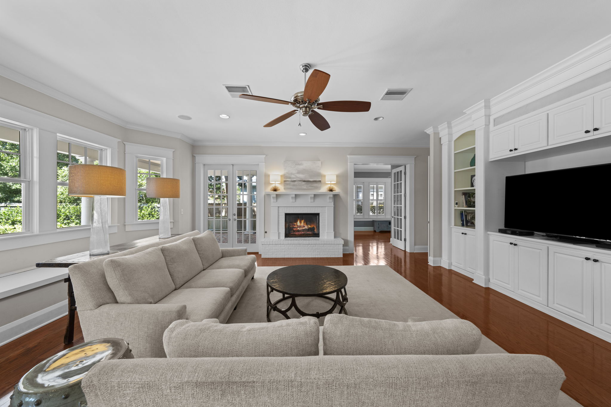 French doors lead to expansive brick rear porch