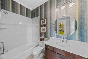 Full bath is accessible from back yard and pool area