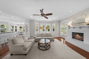 Adjacent living room with gas and wood burning fireplace