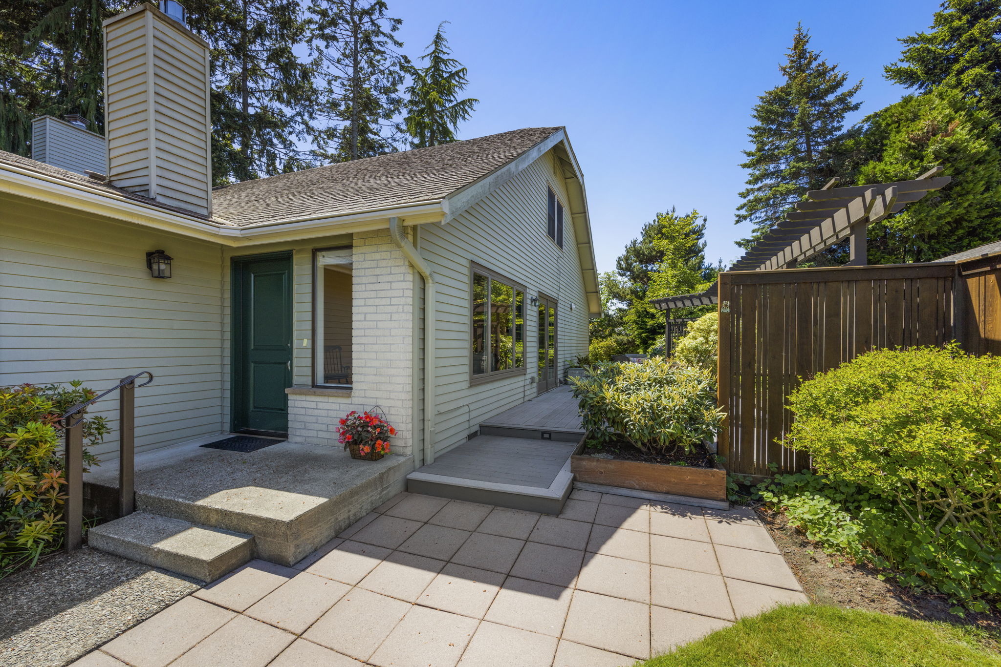 Patio offers access to both the house and the deck.