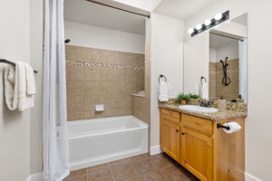 Lovely Full Primary Bath With Granite Counter and Custom Tile Work