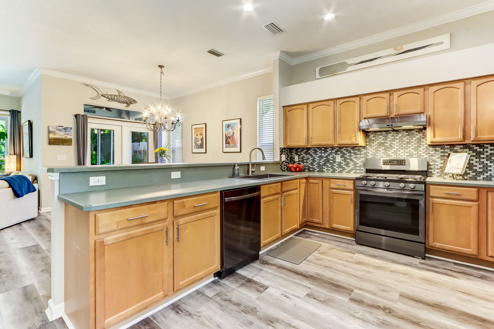 The spacious kitchen has tons of cabinets and 2-yrs new appliances