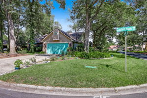 Nestled on a lush corner lot