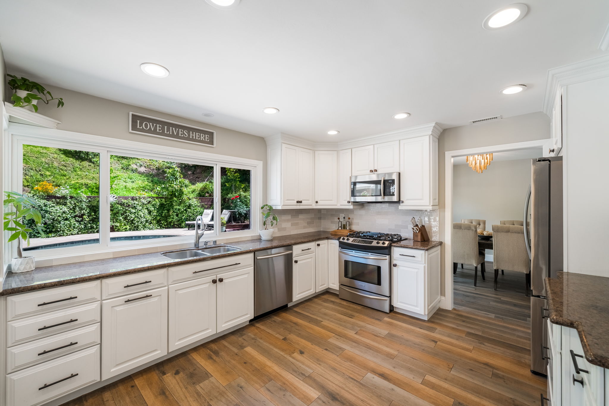 Kitchen Looks Out To Pool Area