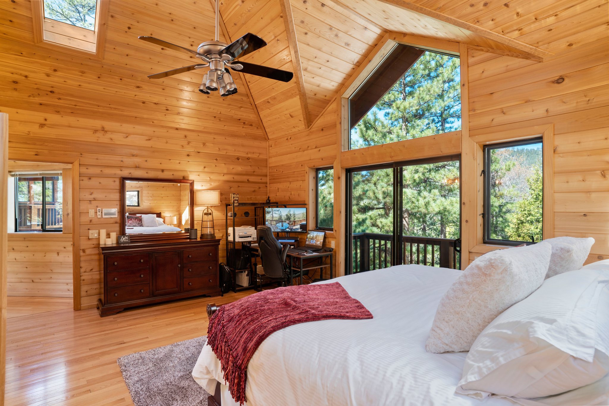 Master bedroom with high ceilings and views.