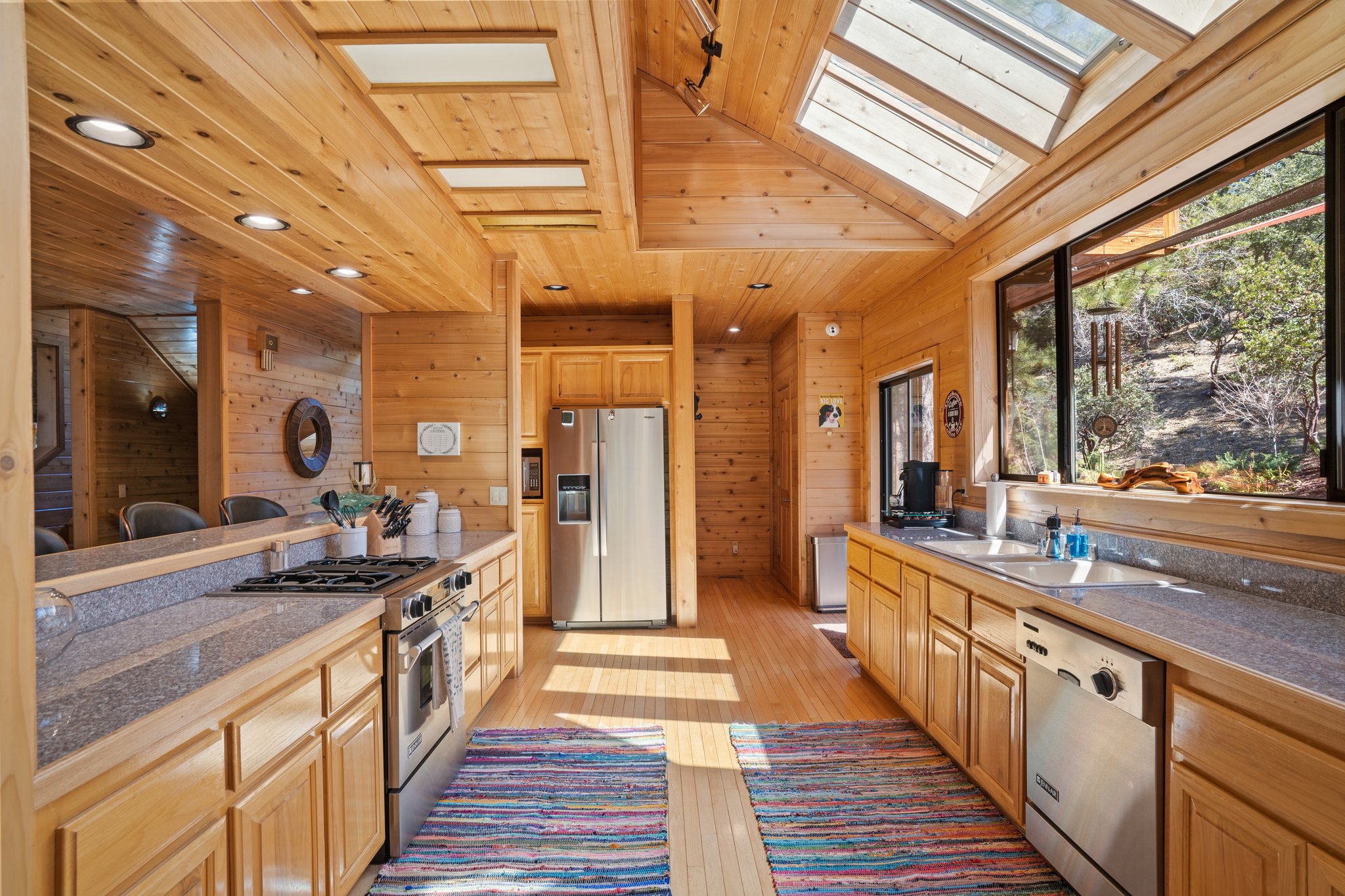 Kitchen with picture window and skylights.