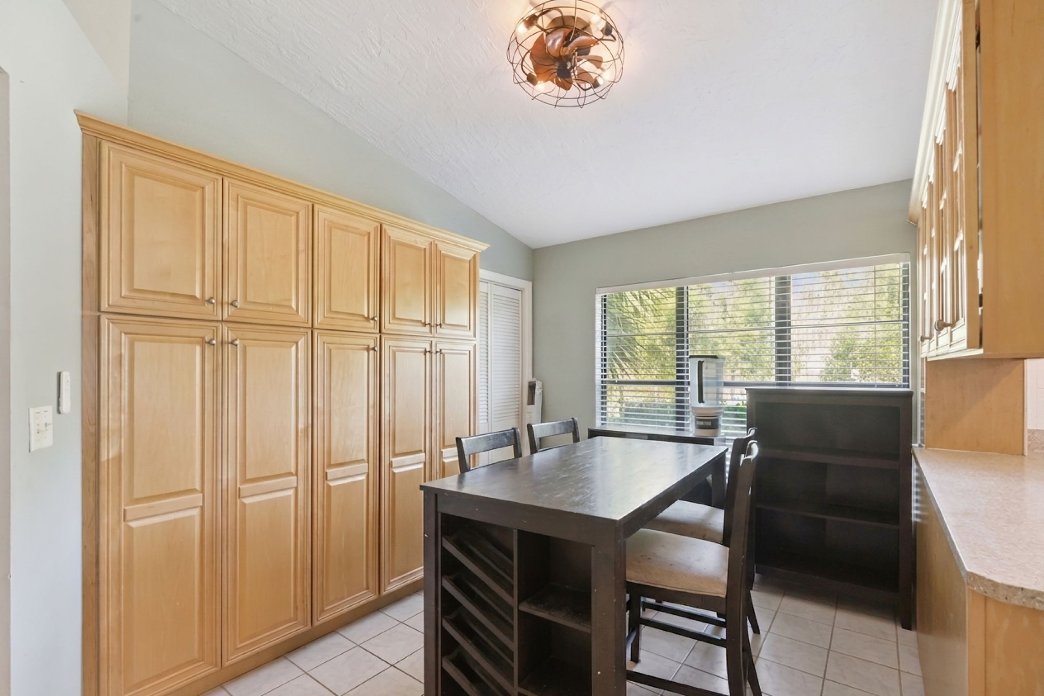 Extra space off the kitchen with plenty of cabintry for storage and room for a craft or breakfast table.