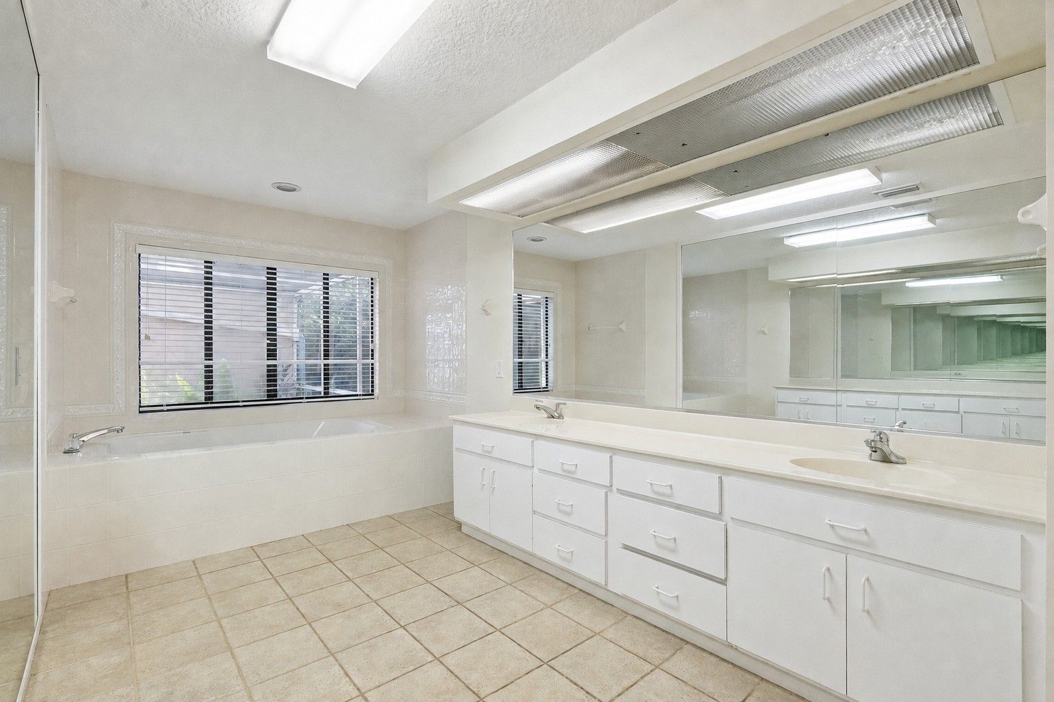 Primary Bath also features private room with walk in shower.