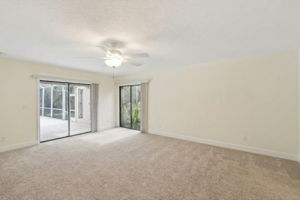 Primary Suite with double sliding glass doors and access to the pool/patio.