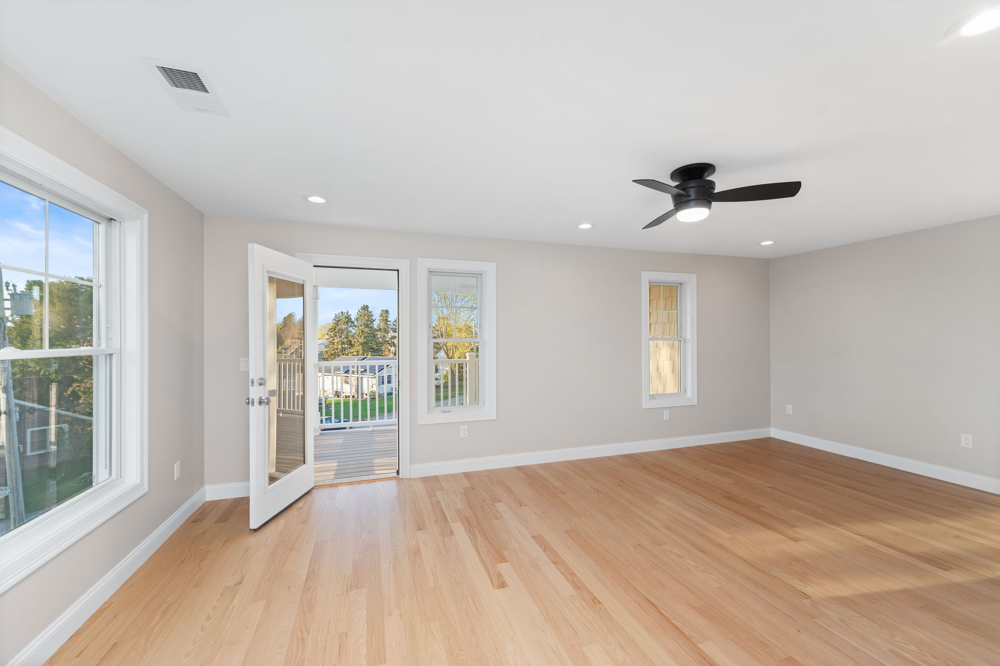 Primary bedroom with private deck with amazing water views