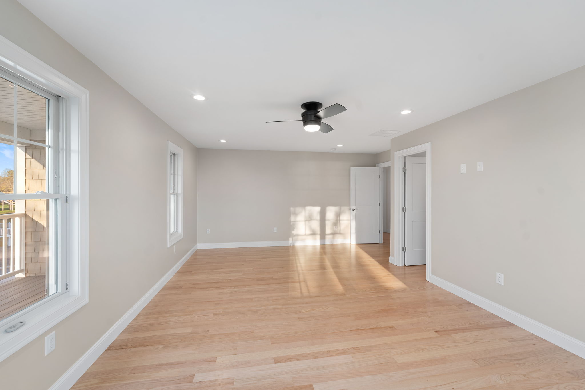 Long View of Primary Bedroom. The open door is to a huge walkin closet