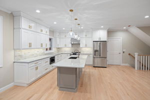 Door to the right of the refrigerator is the elevator!