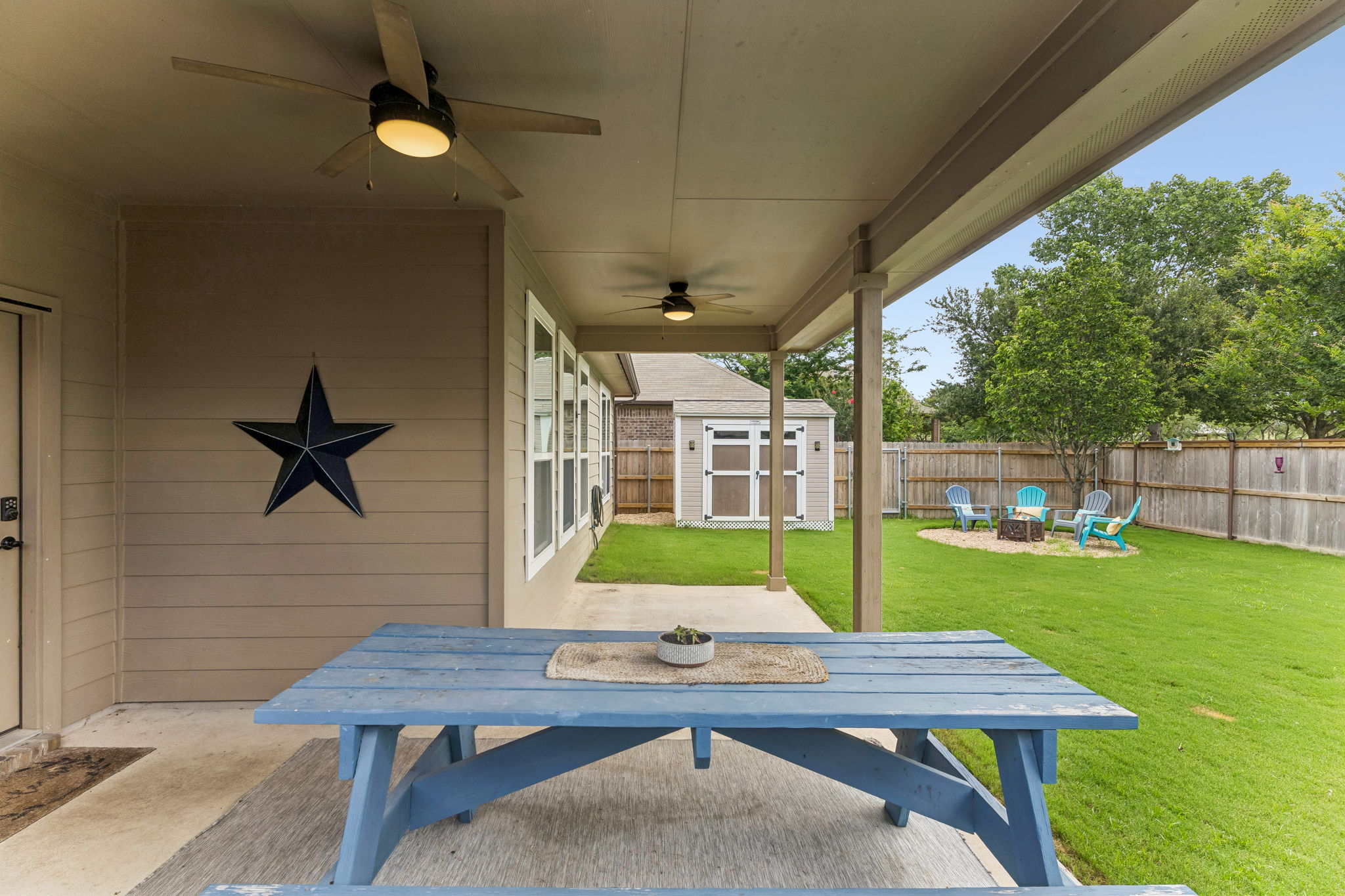 Extended back patio with 2 fans that makes for a great spot for  your outdoor play time.