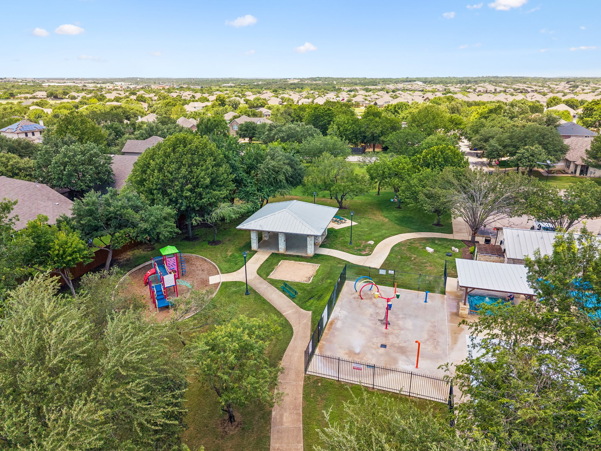 Neighborhood splashpad, pavilion and playground .