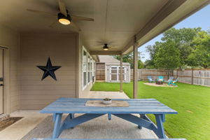 Extended back patio with 2 fans that makes for a great spot for  your outdoor play time.