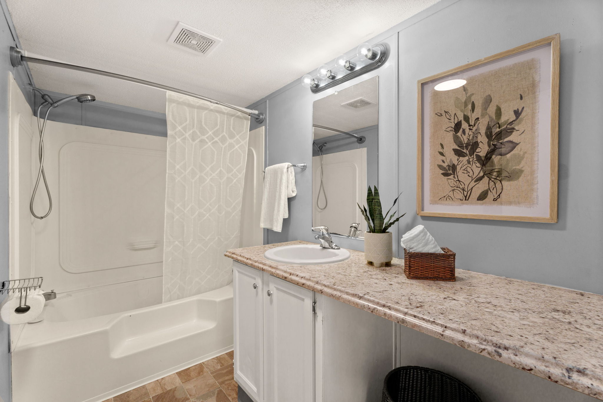 Private primary bathroom with large soaking tub and shower, plenty of counter space and storage.