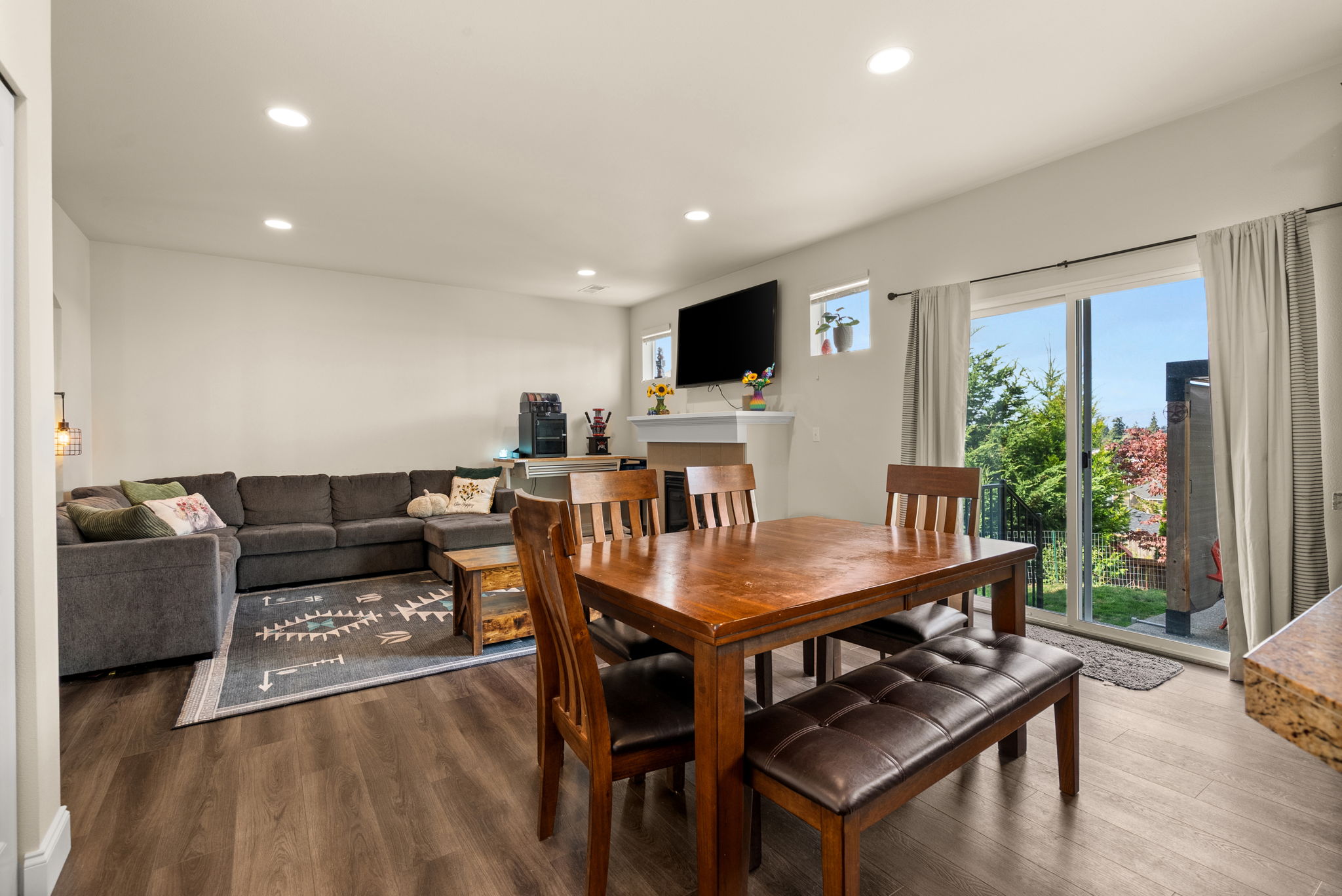 Dining area flows easily between the kitchen and living room with direct access outdoors.