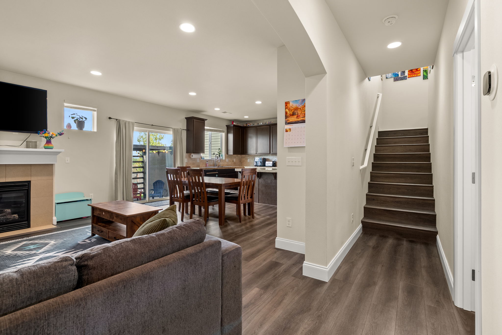 Open main-level layout with easy access to the kitchen, living spaces and upstairs bedrooms.