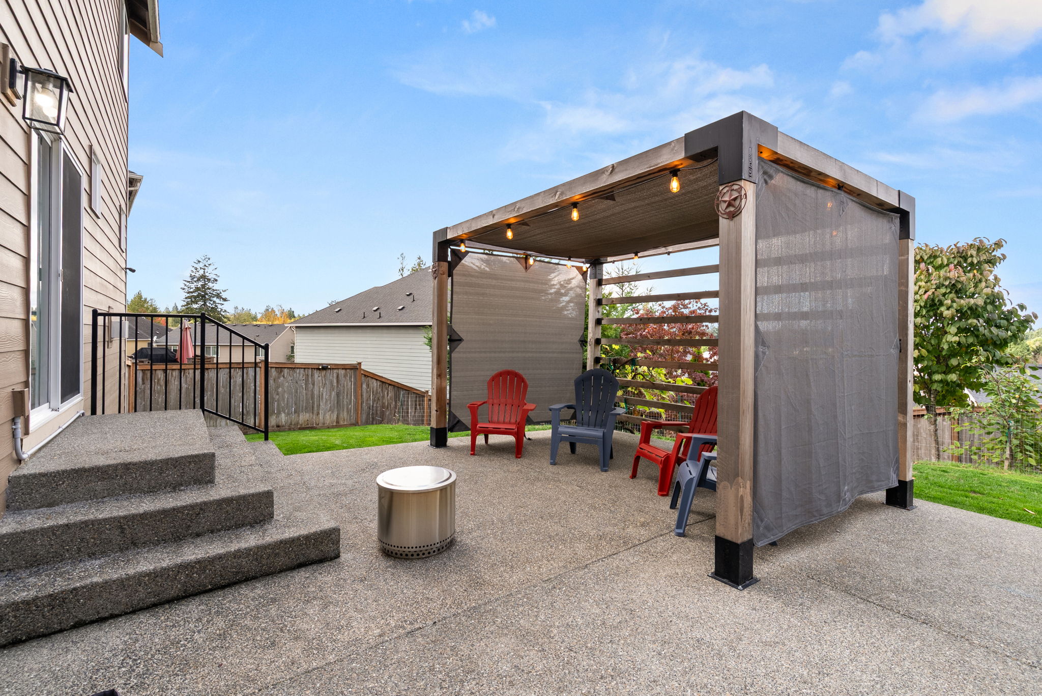 Large backyard patio creates a great space for outdoor gathering and entertaining.