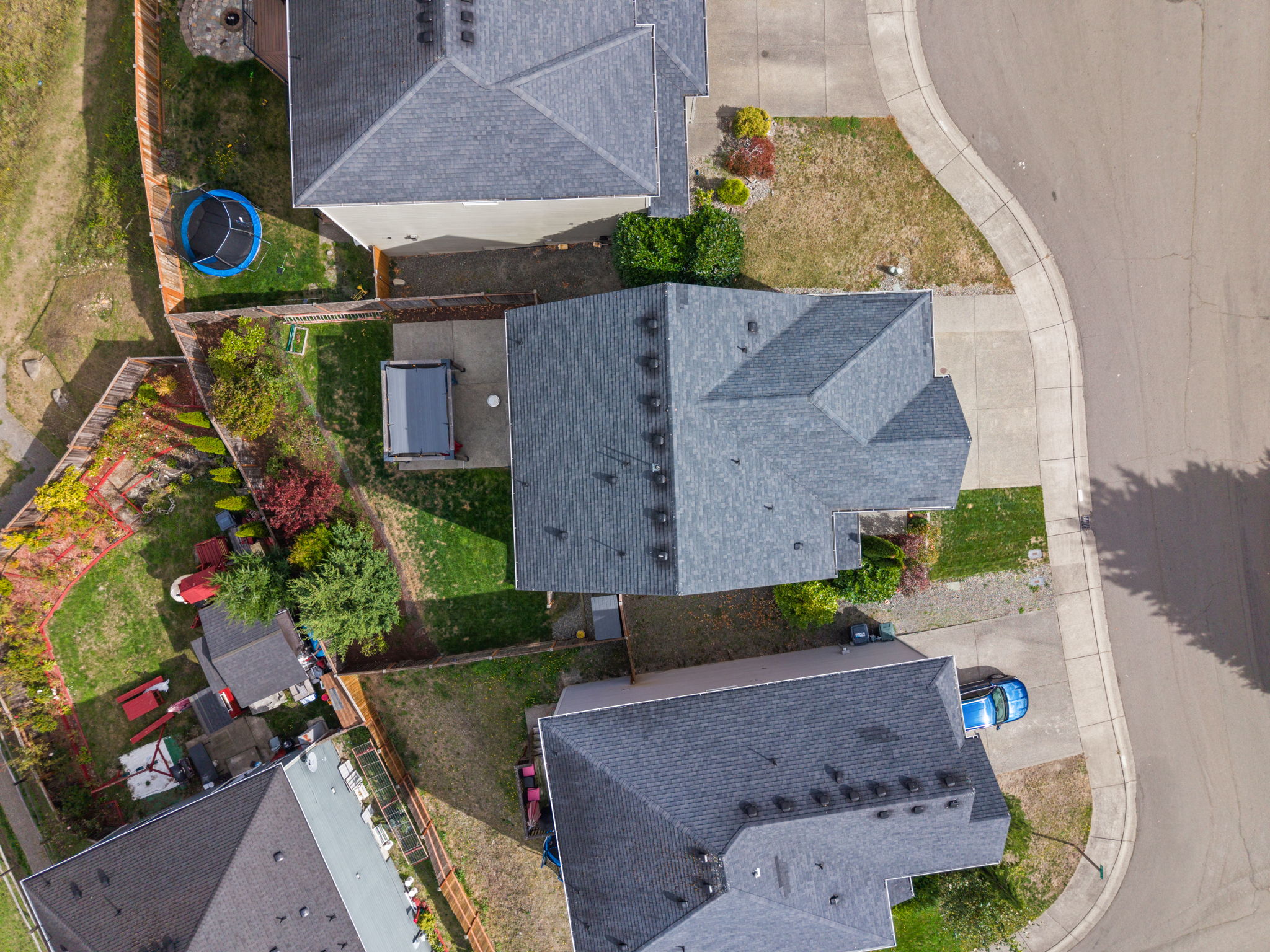 Aerial view highlights the home’s lot, backyard, and neighborhood setting.