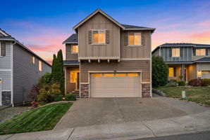 Beautiful two-story home with welcoming curb appeal and attached 2-car garage.