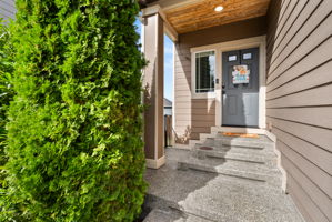 Covered front porch creates a welcoming entry.