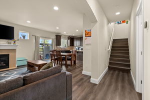 Open main-level layout with easy access to the kitchen, living spaces and upstairs bedrooms.