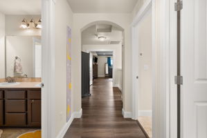 Upstairs hallway connecting the bedrooms, bathrooms, and laundry.