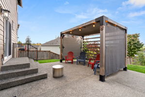 Large backyard patio creates a great space for outdoor gathering and entertaining.