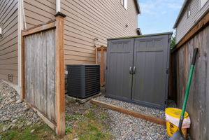 Additional outdoor storage tucked conveniently along the side of the home.