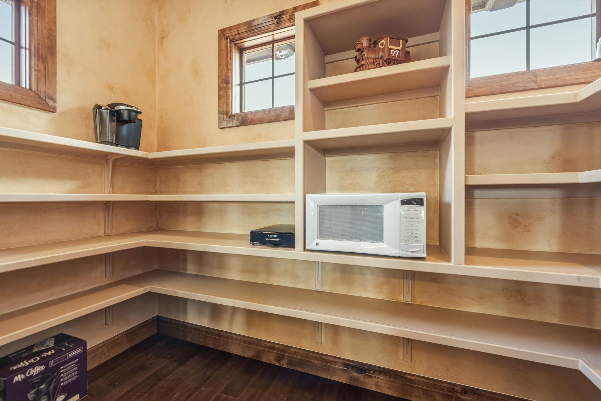 Sizable Pantry with shelfing and natural light.