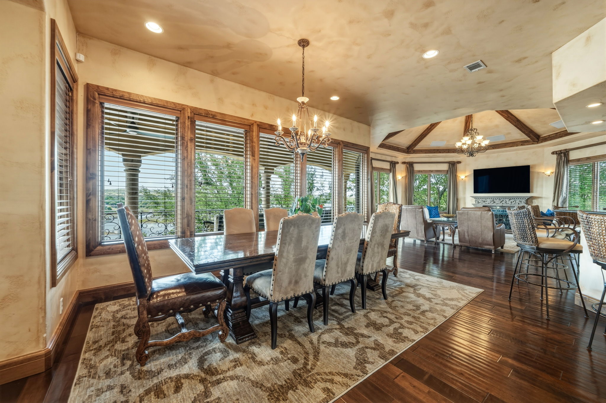 Dining area featuring hardwood floors, a chandelier, and fabulous views of the waterfront.