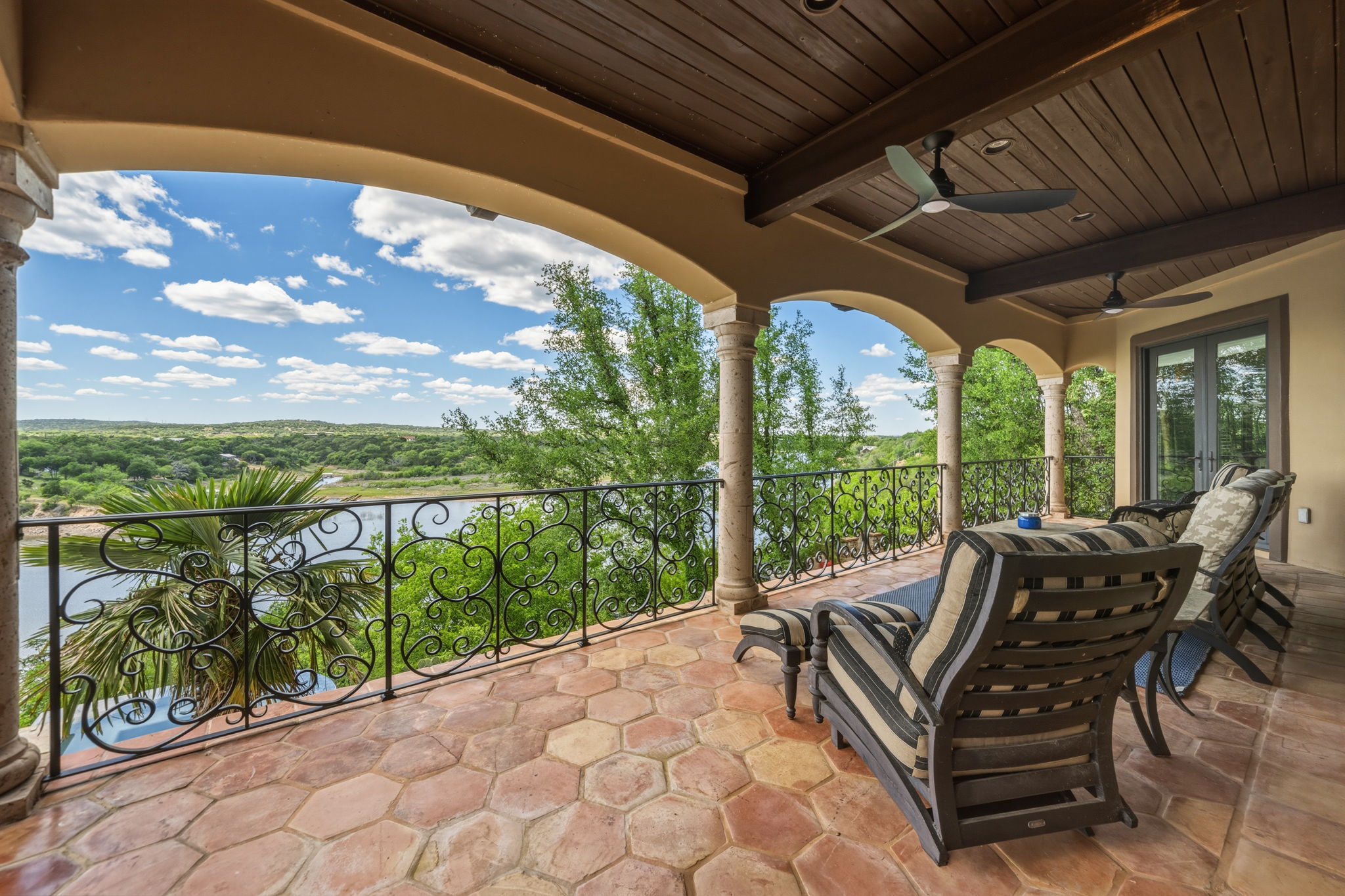 Fabulous views as you relax on the expansive covered porch with wood plank ceiling and exposed beams.