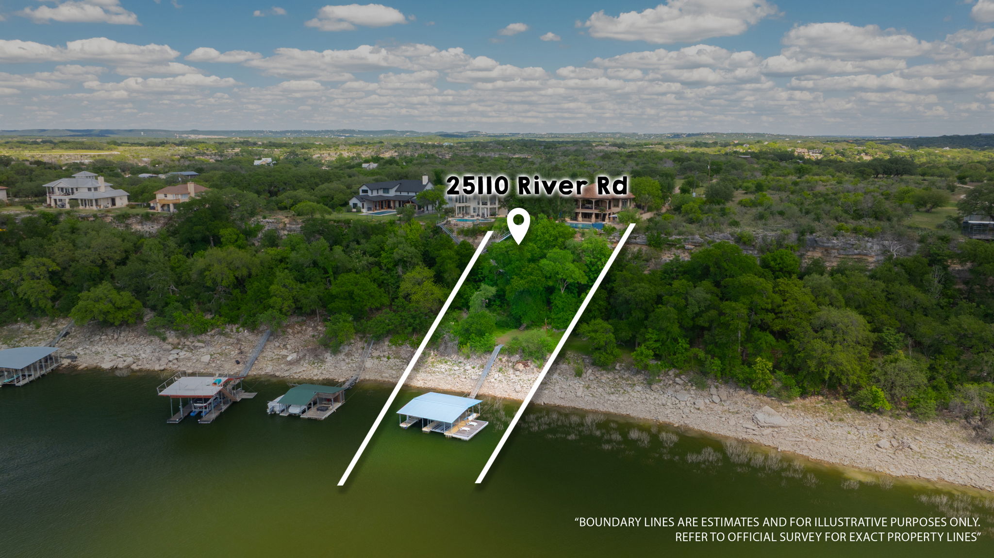 This property features extensive waterfront land with lush trees and a boat dock.