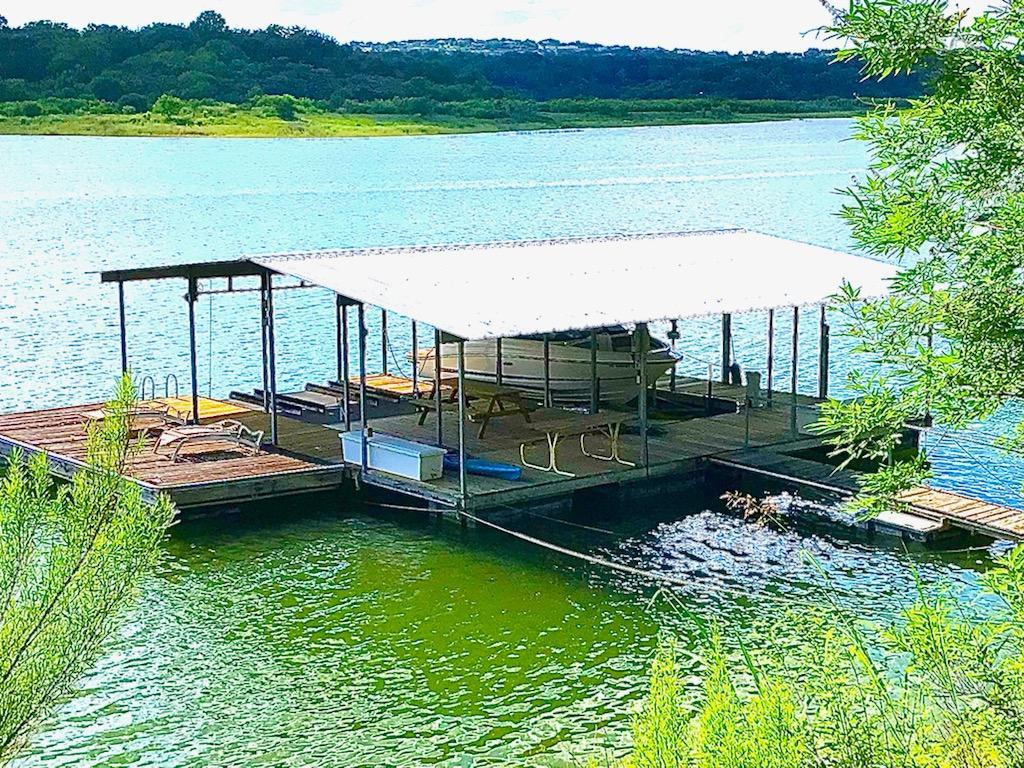 Enjoy your private boat dock with a 24' lift, dual wave runner lifts, spacious sun deck with sweeping Hill Country views.