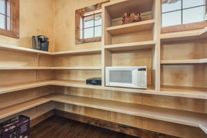 Sizable Pantry with shelfing and natural light.