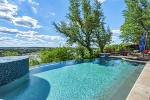 Incredible Views as you experience outdoor living with this refreshing pool, featuring a curved spa with mosaic tiling, and ample patio space for entertaining.