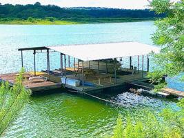 Enjoy your private boat dock with a 24' lift, dual wave runner lifts, spacious sun deck with sweeping Hill Country views.