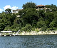Perched above the water, this residence offers a captivating waterfront lifestyle with a private boat dock.