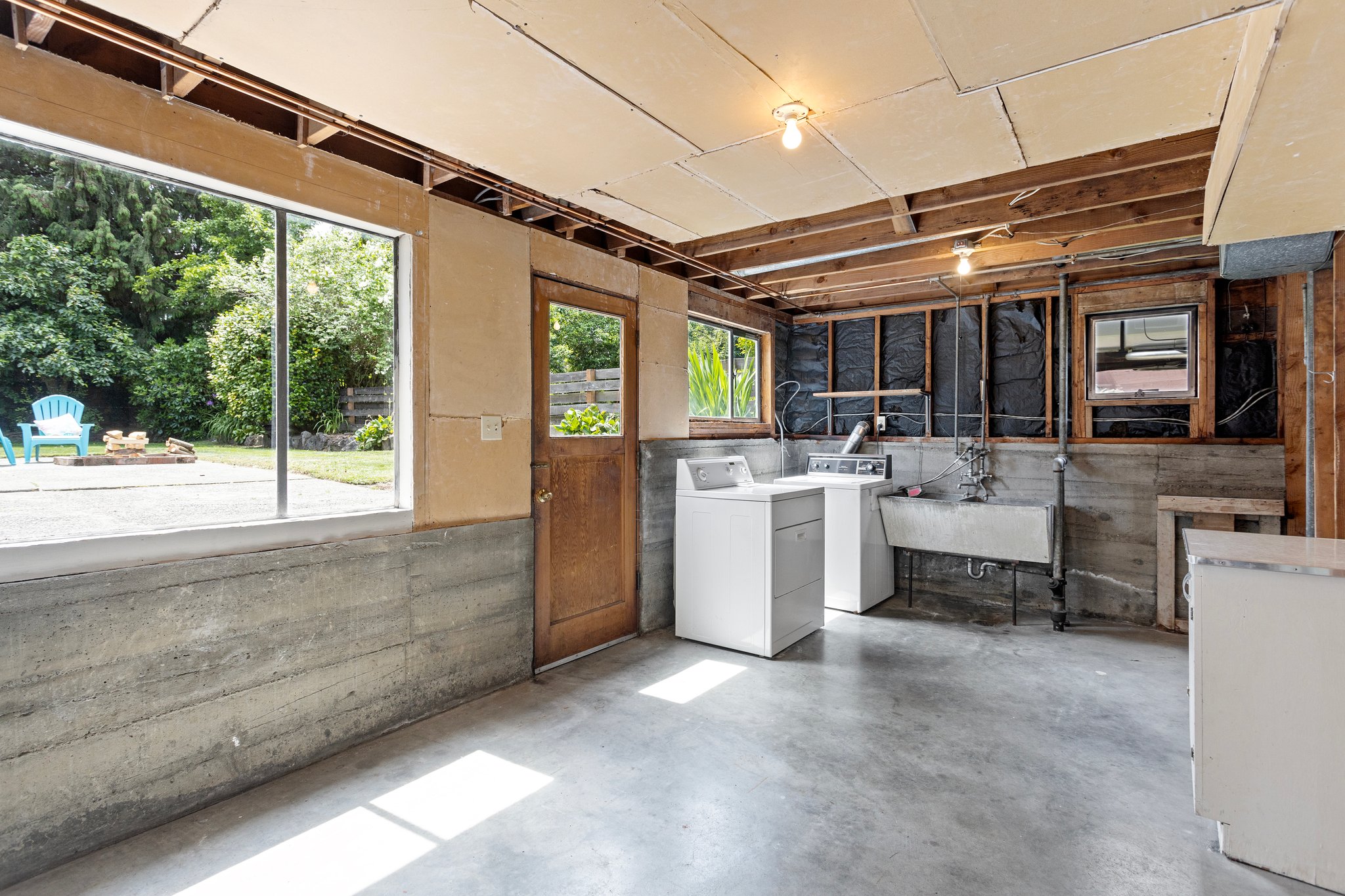 Second bath & kitchen here!? This area is already pre-plumbed for a toilet floor drain and kitchen plumbing, making it easy to add a second bathroom and kitchen and increase your home’s value.
