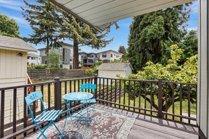 The kitchen opens back to this wrap-around deck that sits above the back yard. It’s a perfect place to unwind, socialize, or keep an eye on the fun below. You’ll love spending time on this deck all year round.