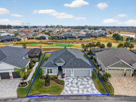 Aerial Front Elevation with Property Lines and Golf Front and Water Views