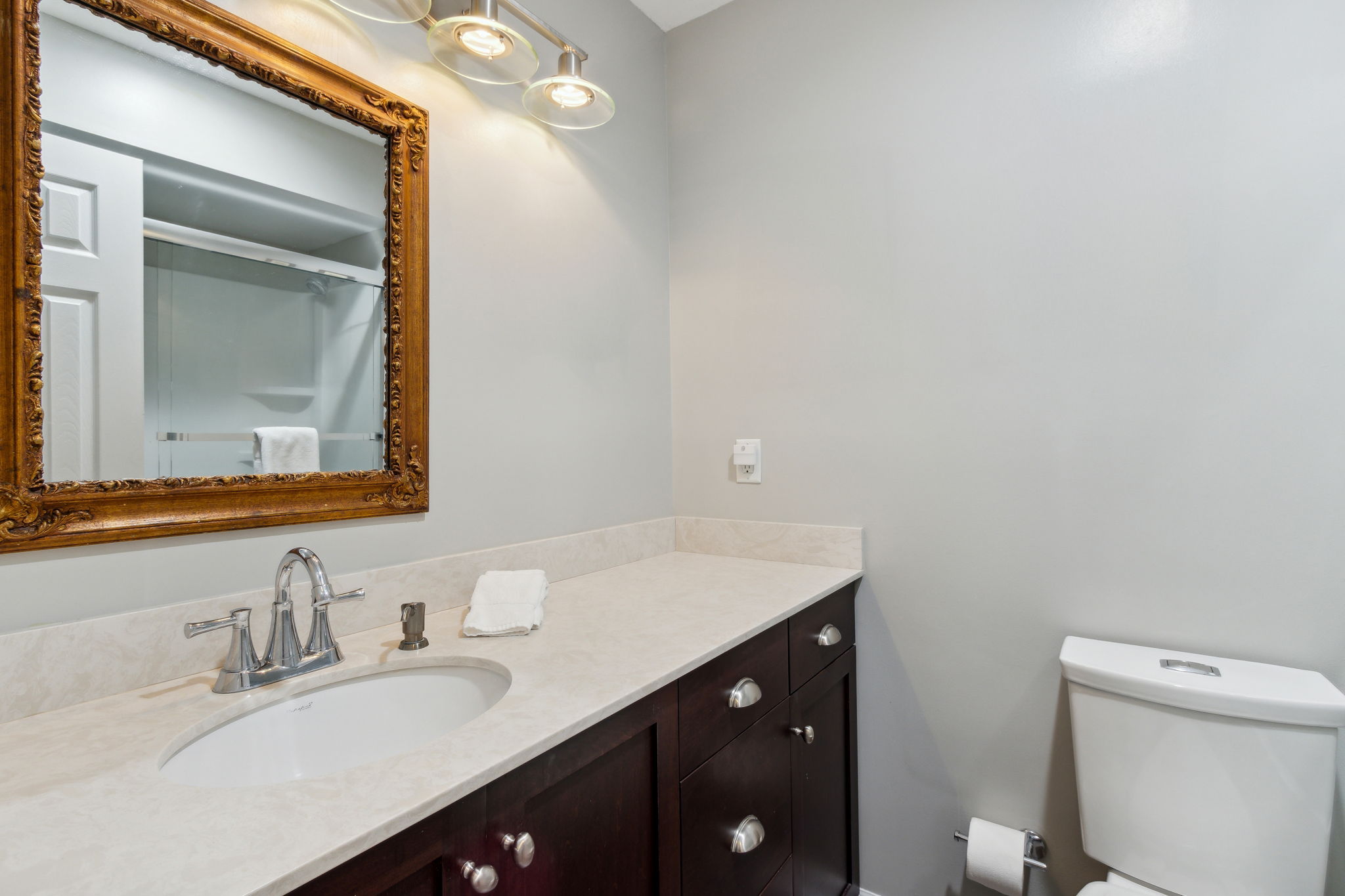 The guest bath with modern raised vanities