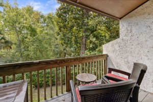 Family room sliders open to a tranquil deck...